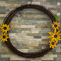 barbwire wreath with sunflowers wall hanging